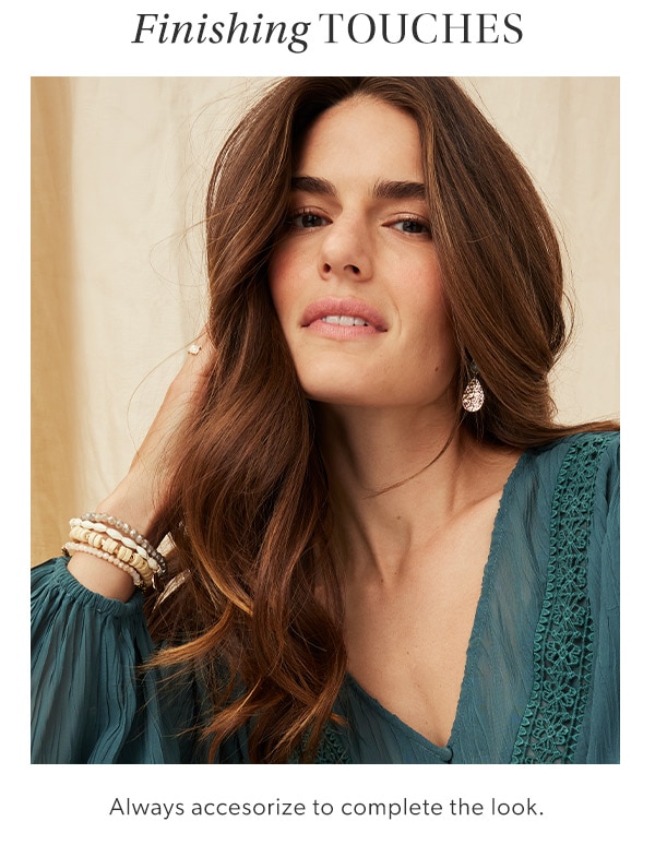 Finishing touches. Always accesorize to complete the look. Model wearing maurices clothing.